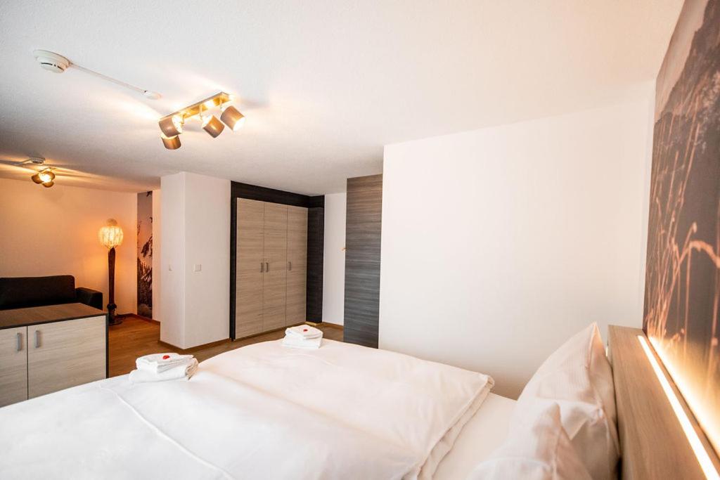 Postel nebo postele na pokoji v ubytování Roggenstock Lodge