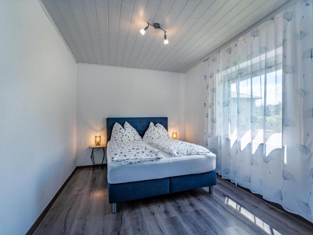 A bed or beds in a room at Apartment Ogris-2 by Interhome