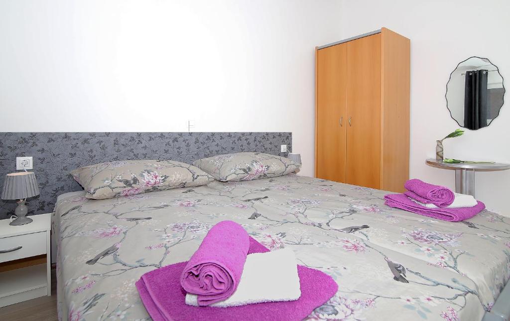 Posteľ alebo postele v izbe v ubytovaní Apartman Blue Bay