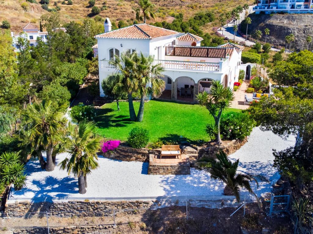 an aerial view of a house with palm trees at Villa Atardecer by Interhome in Torrox Costa
