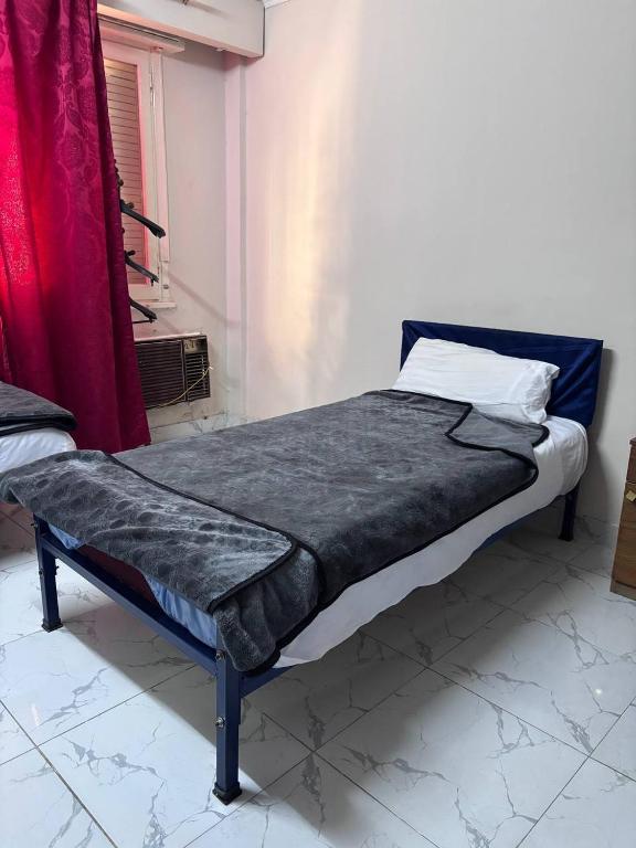 Postel nebo postele na pokoji v ubytování Noor Hotel