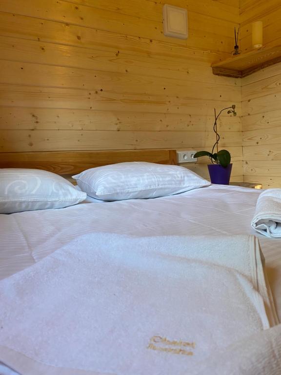 Postel nebo postele na pokoji v ubytování Chalet Ivanna