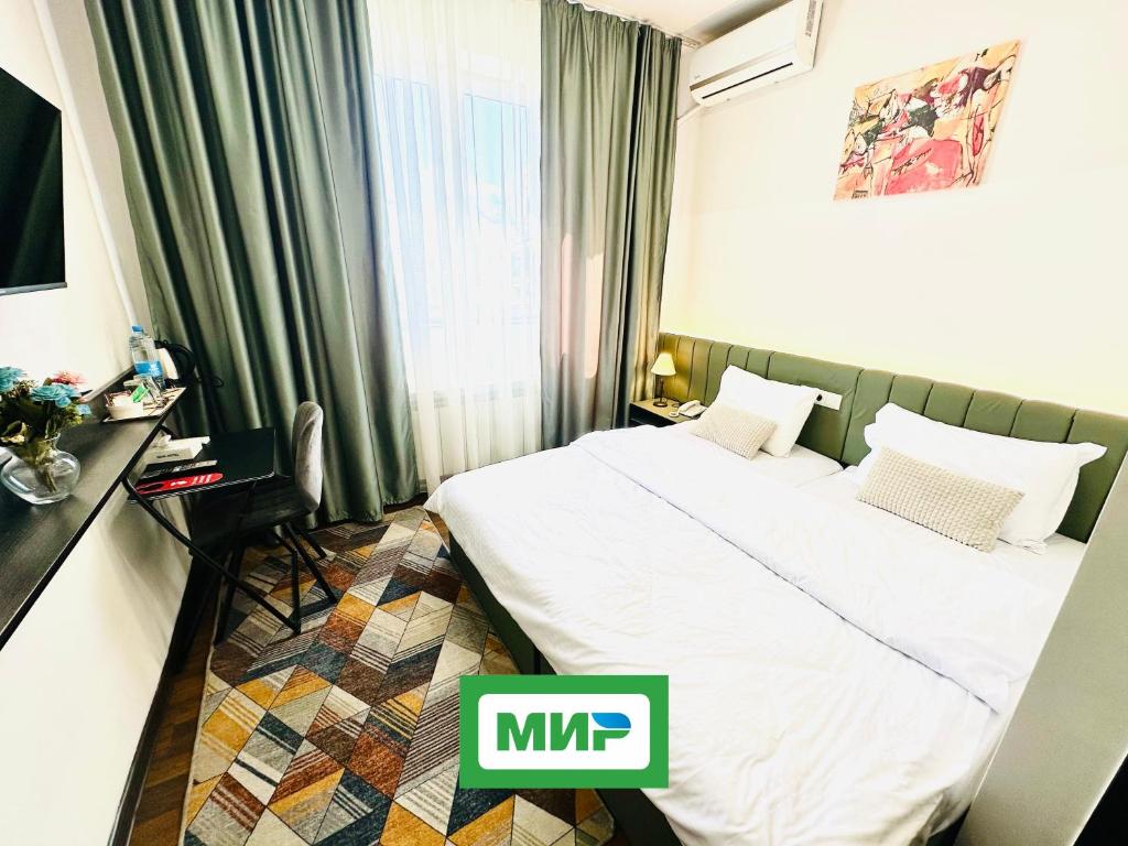 Postel nebo postele na pokoji v ubytování NAVA Hotel Yerevan