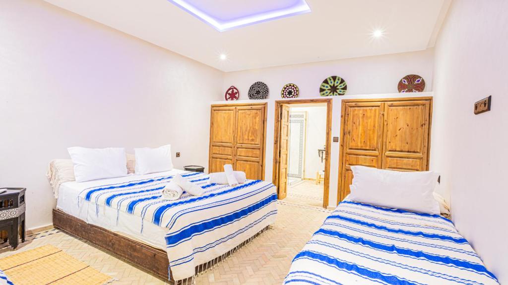 Postel nebo postele na pokoji v ubytování Maison D'hôte Zomorroda