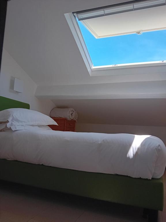 Postel nebo postele na pokoji v ubytování Hotel Paradiso Portov enere