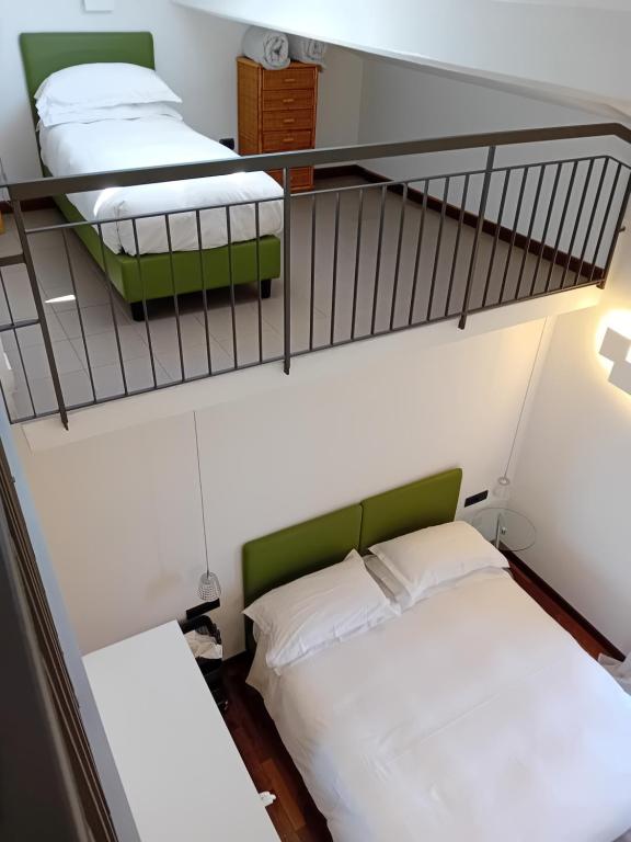 Postel nebo postele na pokoji v ubytování Hotel Paradiso Portov enere