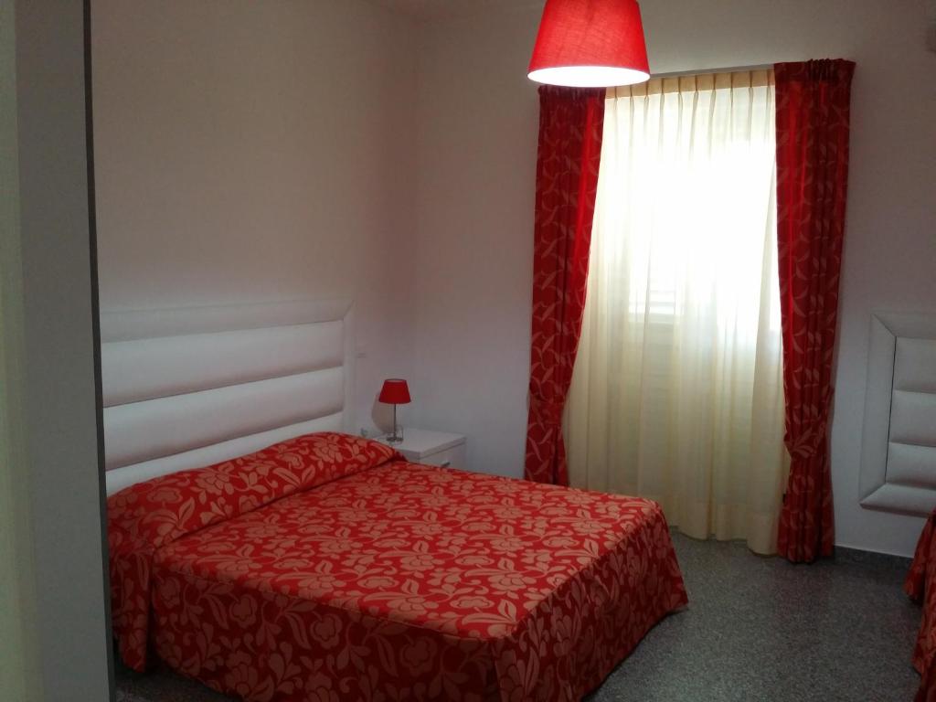 Postel nebo postele na pokoji v ubytování Le Castella B&B Restaurant