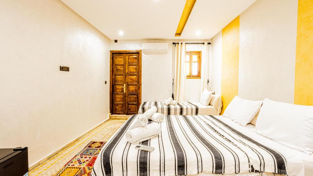 Postel nebo postele na pokoji v ubytování Maison D'hôte Zomorroda