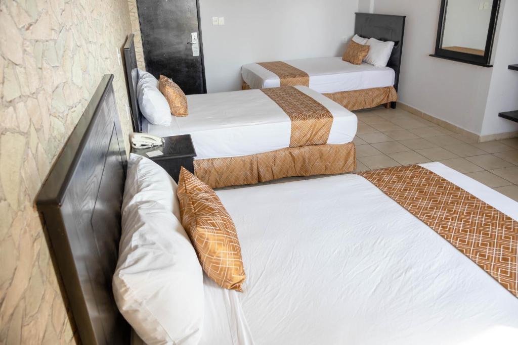 Postel nebo postele na pokoji v ubytování Hotel Costa Verde