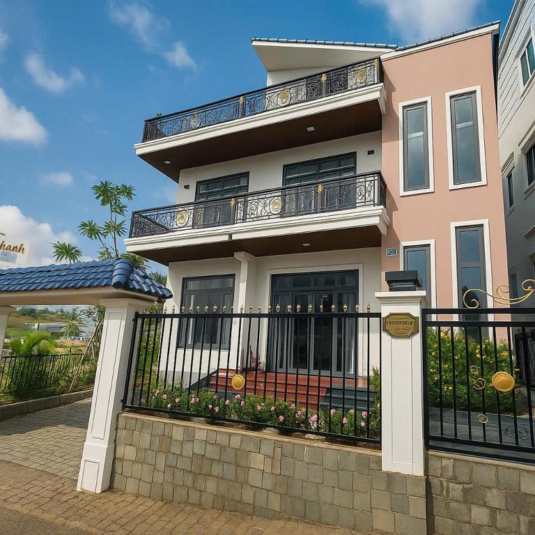 a house with a fence in front of it at Villa Thanh Thanh in Da Lat