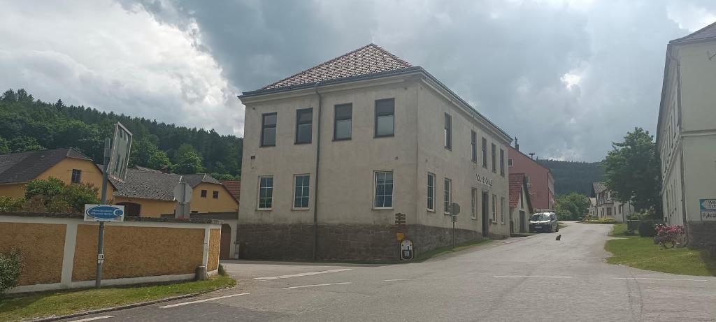 a large building on the side of a street at Frühstückspension Alte Volksschule Heinrichs bei Weitra in Heinreichs bei Weitra