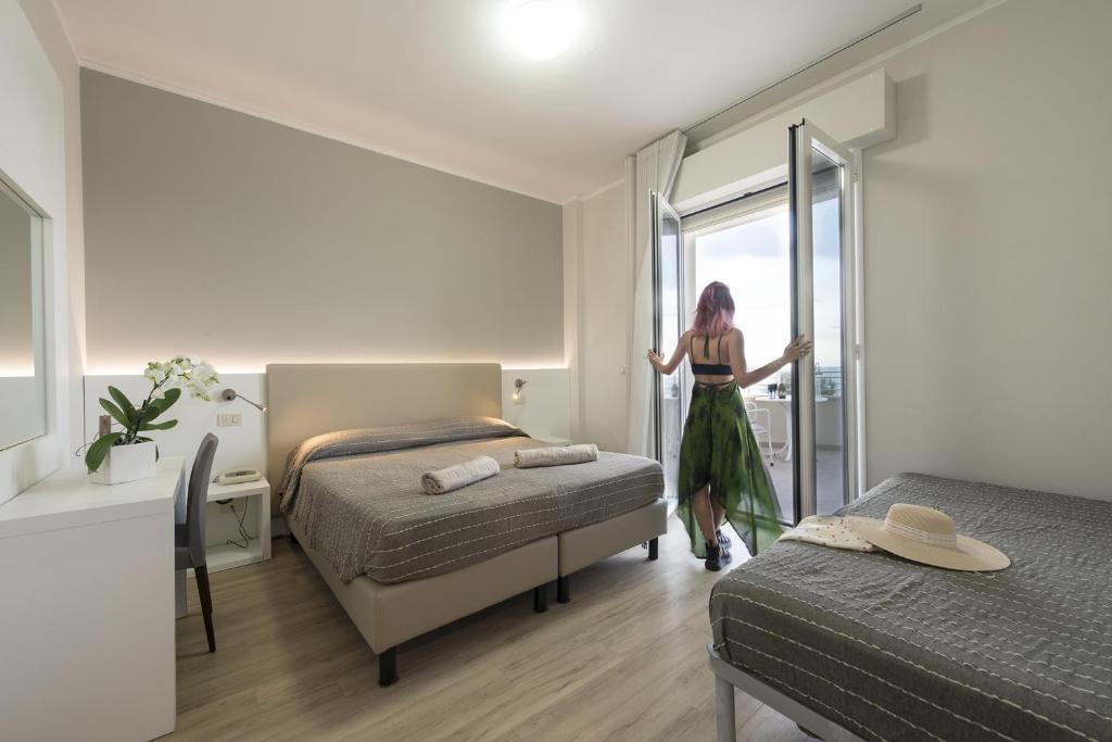 Postel nebo postele na pokoji v ubytování Hotel Royal