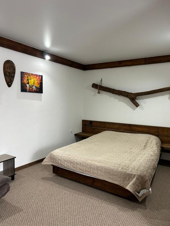 Postel nebo postele na pokoji v ubytování Гостьовий Дім Guest House