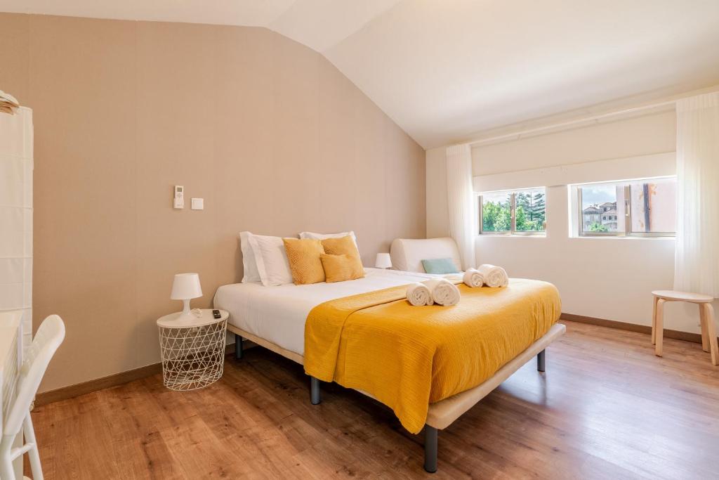 Postel nebo postele na pokoji v ubytování Petit Suites by PCALE