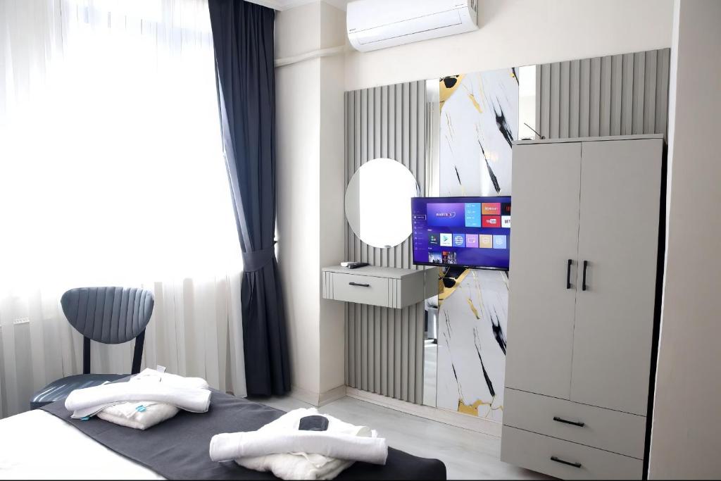 Ένα ή περισσότερα κρεβάτια σε δωμάτιο στο Blanco Boutique Hotel