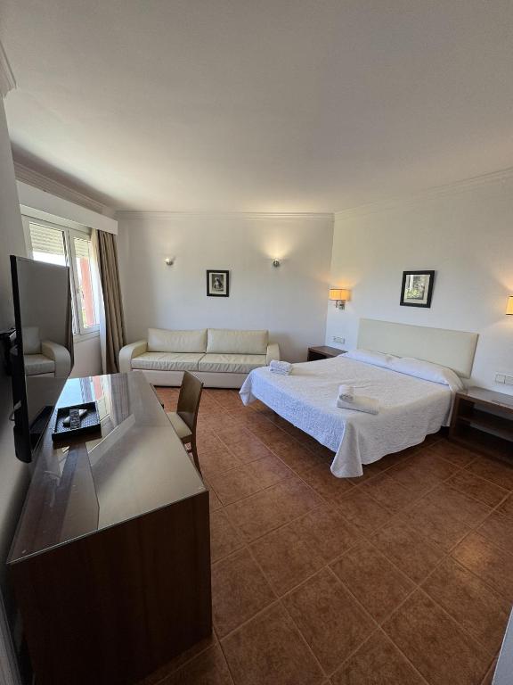 Postel nebo postele na pokoji v ubytování Hotel Las Camelias