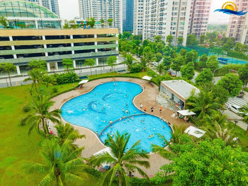 an overhead view of a swimming pool in a resort at Studio Vinhomes Ocean Park in Gia Lâm Pho
