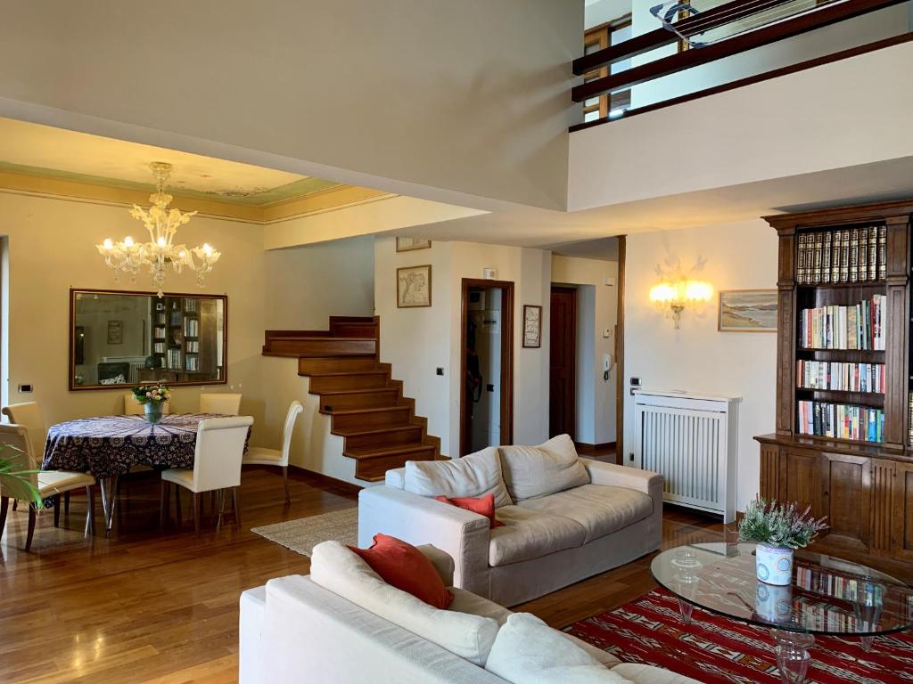 a living room with a couch and a table at Vistalaguna Orbetello in Orbetello