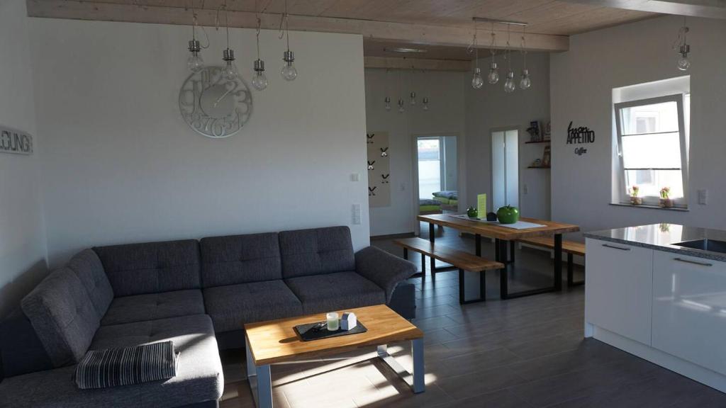 a living room with a couch and a table at Apartment Inge in Rheinhausen