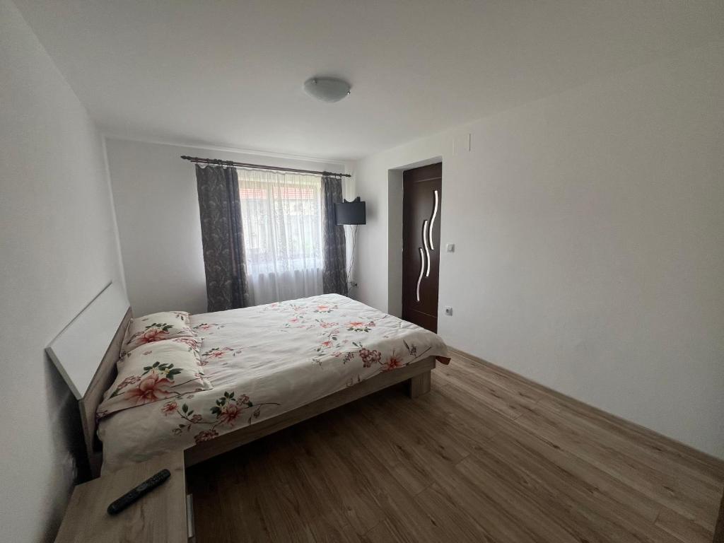 Postel nebo postele na pokoji v ubytování CASA ANDREI