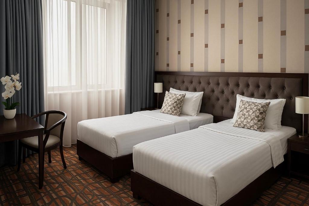 Postel nebo postele na pokoji v ubytování Yerevan Resident Hotel