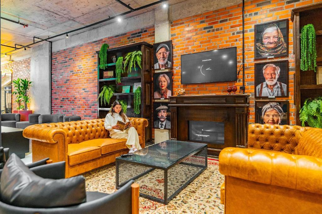 Televiisor ja/või meelelahutuskeskus majutusasutuses Linked Batel by Xtay - Experiencia moderna e conectada a passos do Hard Rock