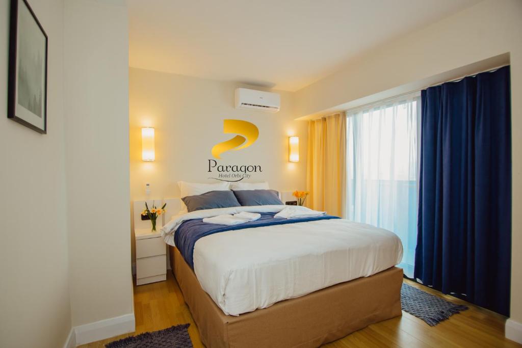 Postel nebo postele na pokoji v ubytování PARAGON HOTEL - Orbi City