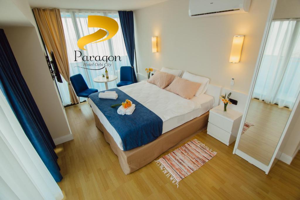 Postel nebo postele na pokoji v ubytování PARAGON HOTEL - Orbi City