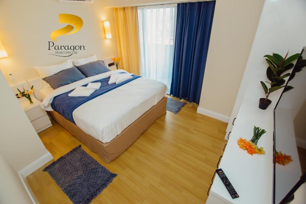 Postel nebo postele na pokoji v ubytování PARAGON HOTEL - Orbi City