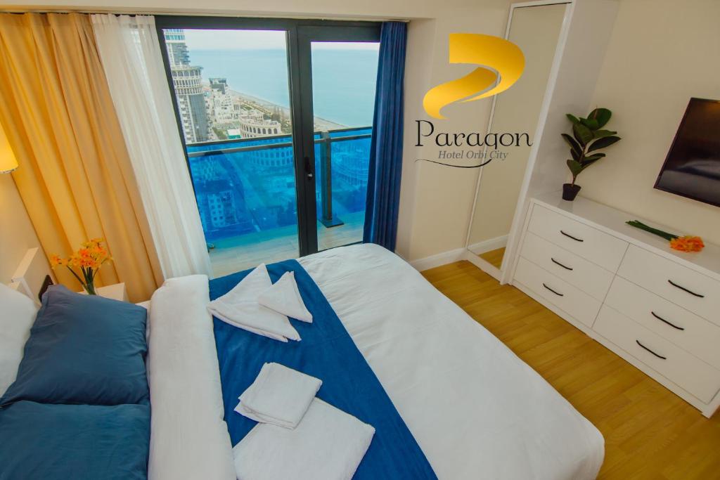 Postel nebo postele na pokoji v ubytování PARAGON HOTEL - Orbi City