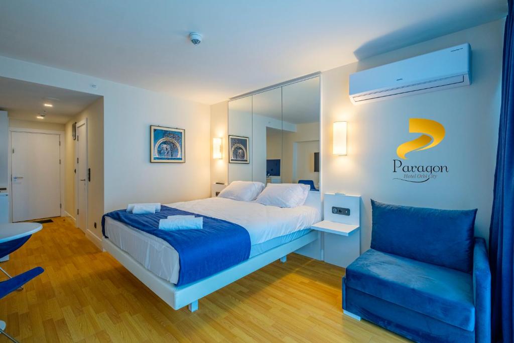 Postel nebo postele na pokoji v ubytování PARAGON HOTEL - Orbi City