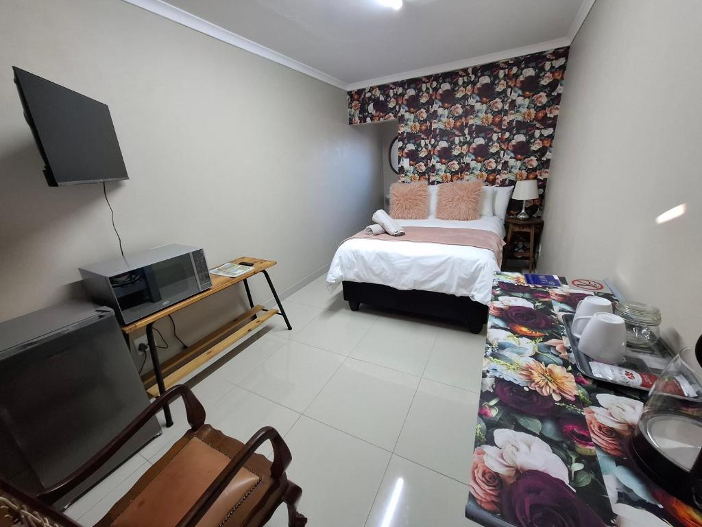 TV a/nebo společenská místnost v ubytování Addo River Den