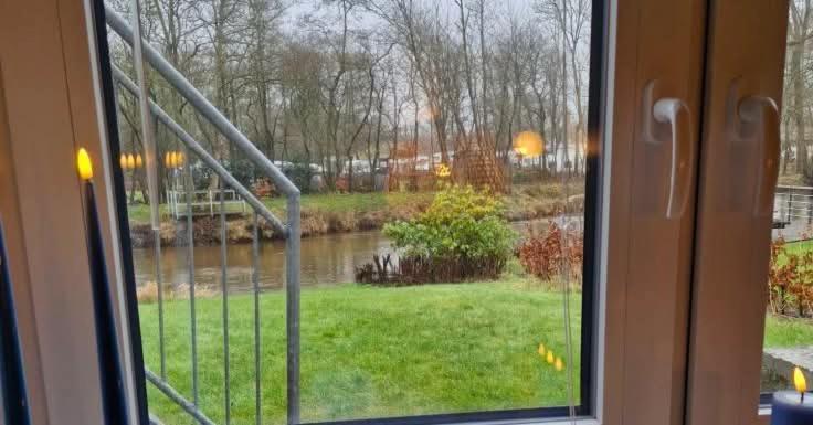 a view of a river from a window at Bredgade 38 - Downstairs in Sønder Felding