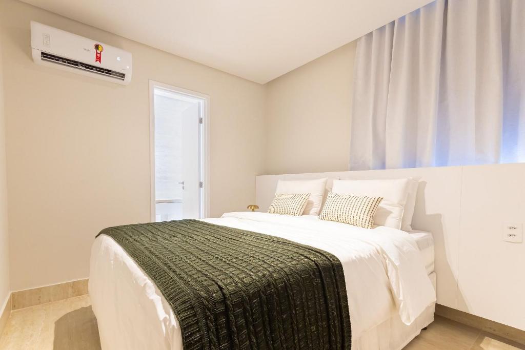 Giường trong phòng chung tại Tolive Riverside HOUSI by Carpediem