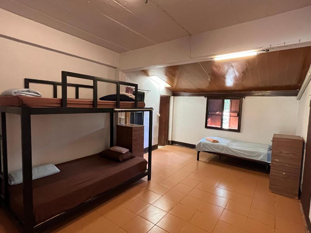 Postel nebo postele na pokoji v ubytování Shaya Homestay & Dorms