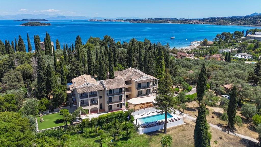 an aerial view of a mansion with a lake at Alvia Suites in Corfu Town