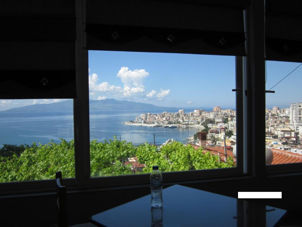 a view of the ocean from a window at Guest House and Tavern Leo in Sarandë