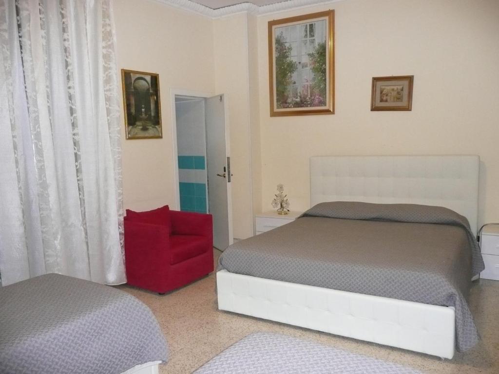 Postel nebo postele na pokoji v ubytování I Papiri B&B Aparthotel