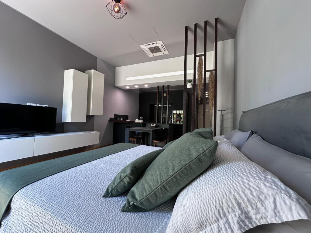 Кровать или кровати в номере Deluxe apartment la Castagna