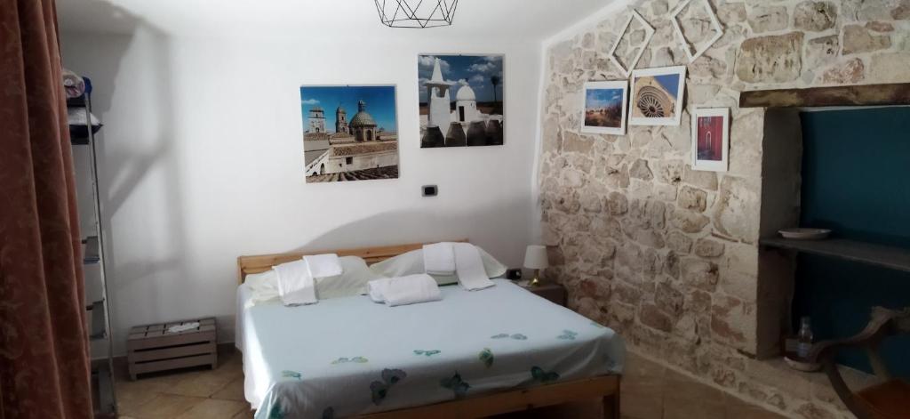 Postel nebo postele na pokoji v ubytování Dimora delle Badesse