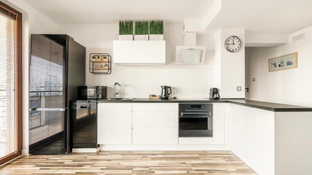 Kuchyň nebo kuchyňský kout v ubytování Comfy Apartments - Transatlantyk Lux