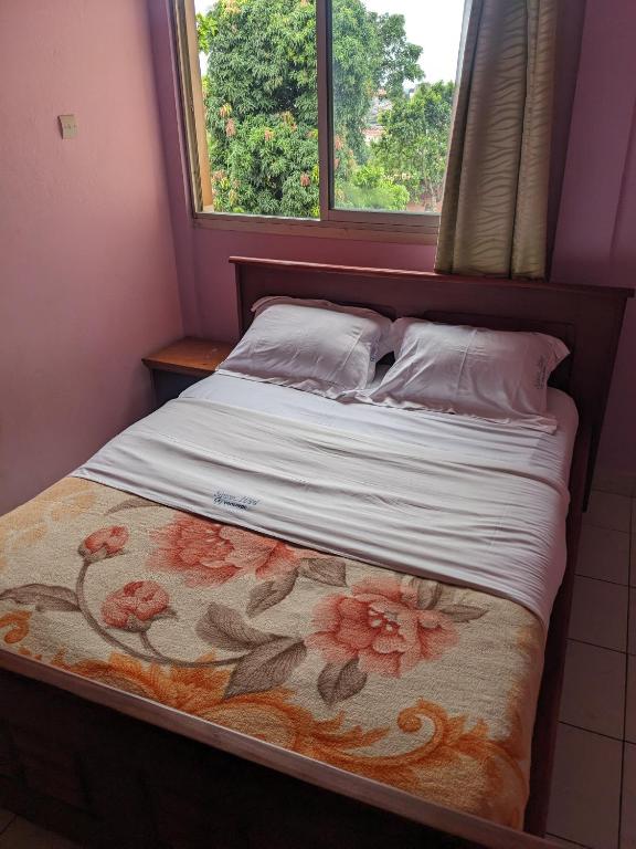 Postel nebo postele na pokoji v ubytování GRÂCES hôtel