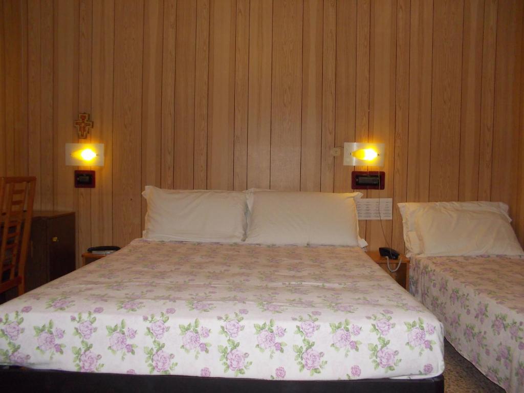 Postel nebo postele na pokoji v ubytování Hotel Giordano Spiaggia