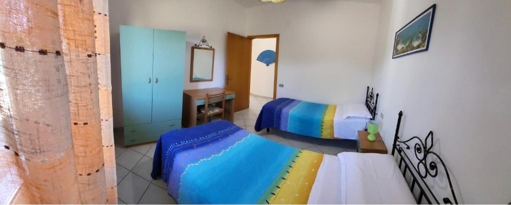 Posteľ alebo postele v izbe v ubytovaní Villa Ilaria casa vacanza Capo Vaticano - Tropea