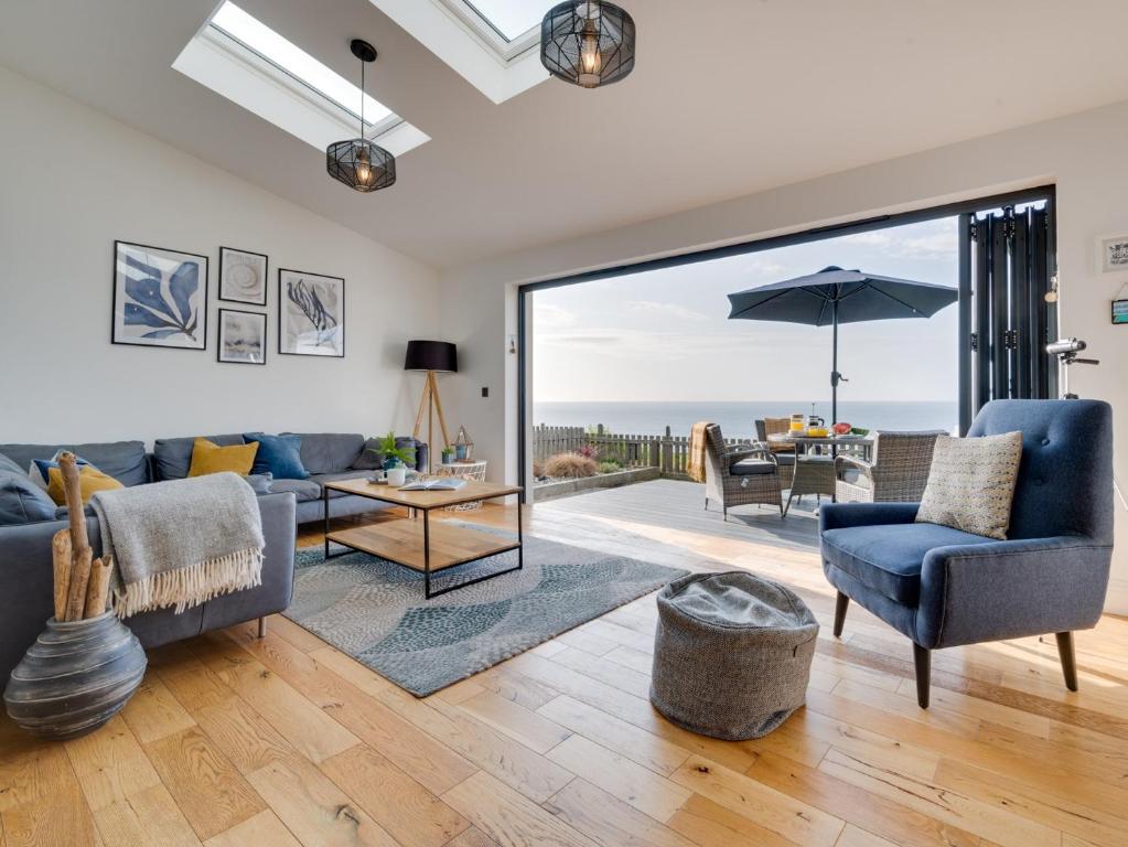 a living room with a view of the ocean at 2 Bed in Anstruther 66733 in Pittenweem