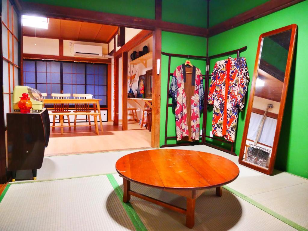 a room with a room with a table and a room with a room at Tsugaru House1 in Aomori