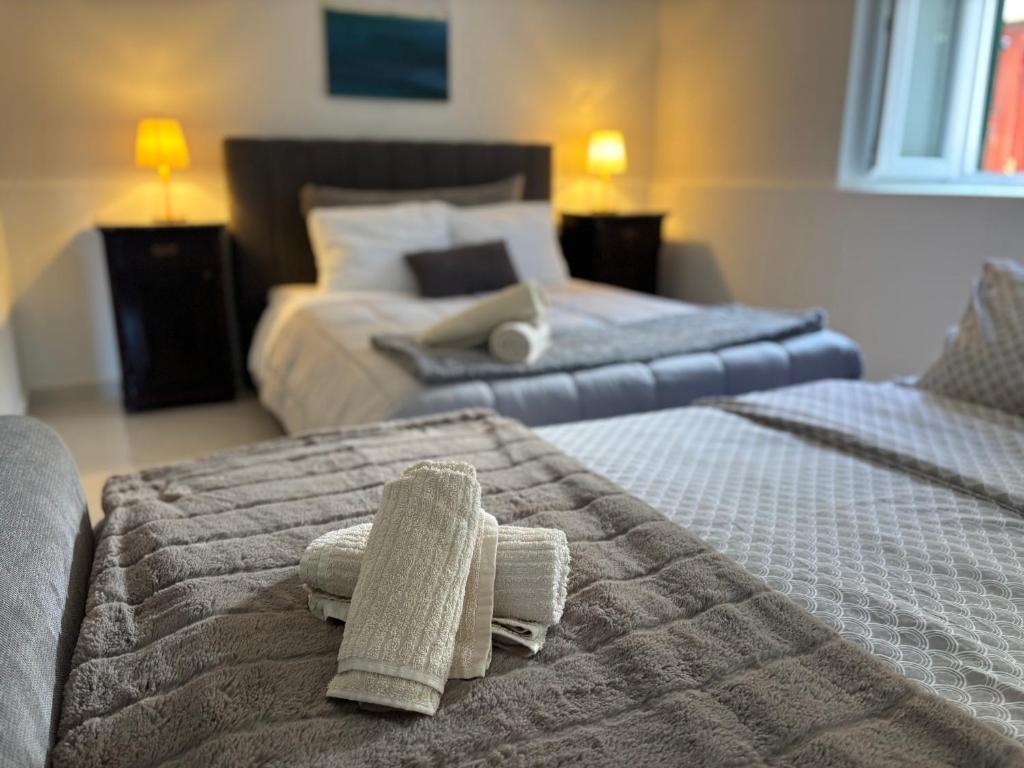 Postel nebo postele na pokoji v ubytování Studio Apartment Krapanj
