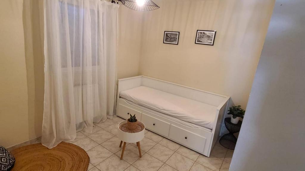 Postel nebo postele na pokoji v ubytování Maison avec jardin à Frontignan