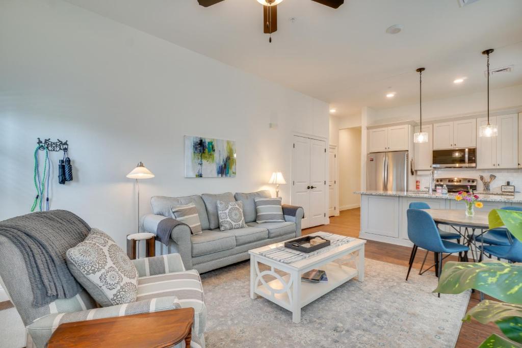 a living room with a couch and a table at Walk to Historic Maryville True Southern Getaway! in Maryville