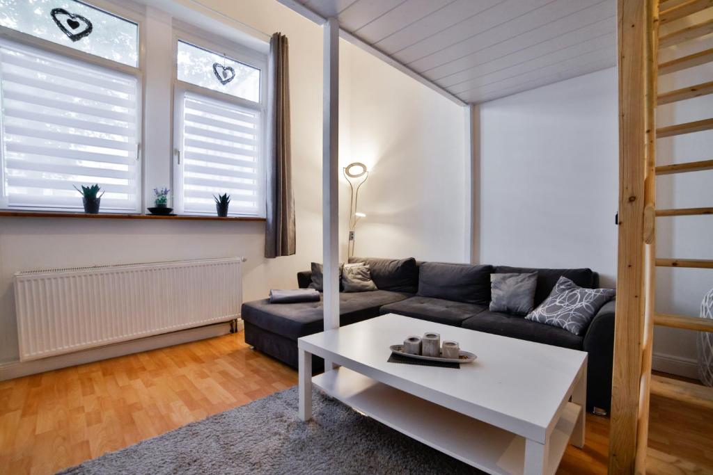พื้นที่นั่งเล่นของ Komfortables City Apartment im Historischen Wohnhaus